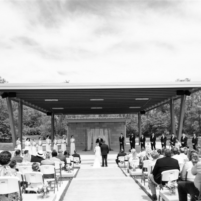 The couple to be married stands at the alter at O'Day Park Amphitheater.